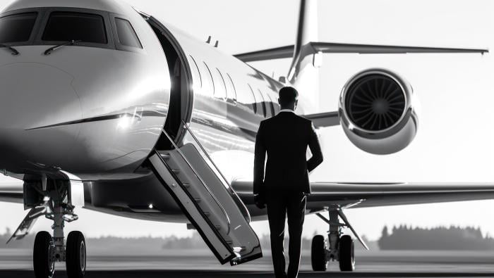 Man walking toward business jet