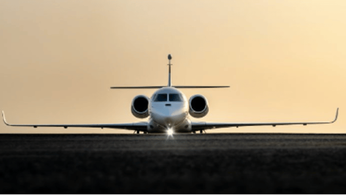 a Dassault Falcon jet facing away from the camera