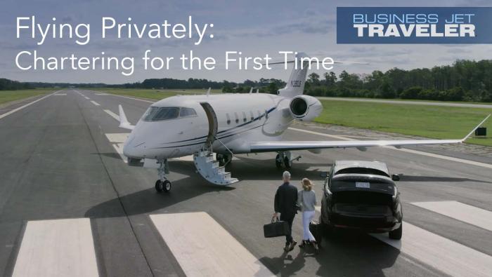 Business jet on runway with people about to board after leaving their car