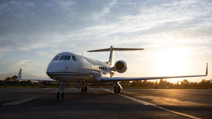 business jet on a ramp at twilight