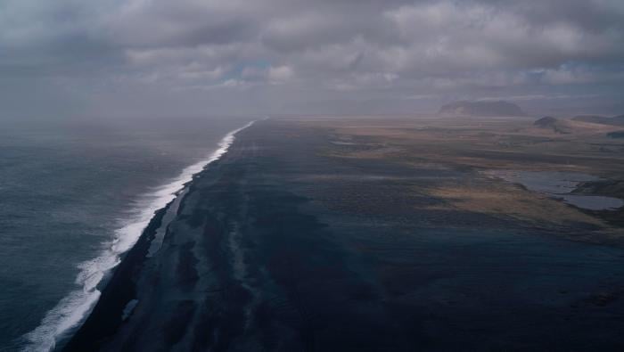 aerial image of ocean waves near land