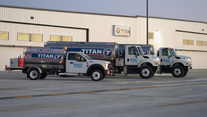 Titan branded fuel trucks on ramp