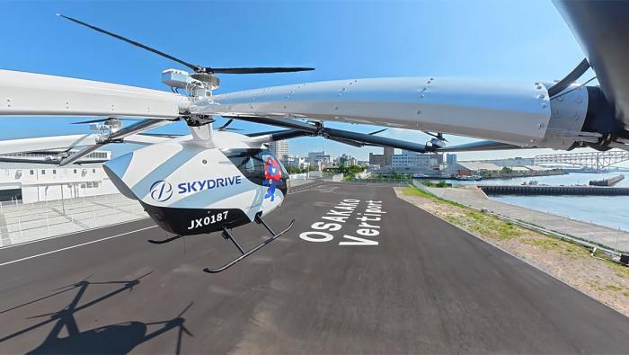 SkyDrive’s SD-05 eVTOL flies over the Osakako Vertiport during Expo 2025 demonstrations in Osaka, Japan.