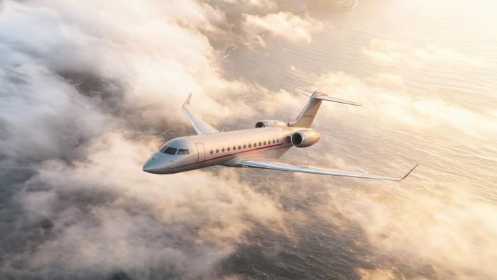 VistaJet Global 8000 in flight above clouds