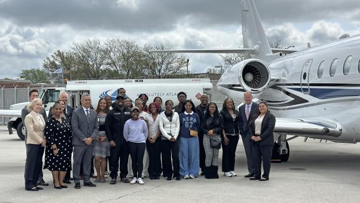 Barrington Irving and students in front of business jet