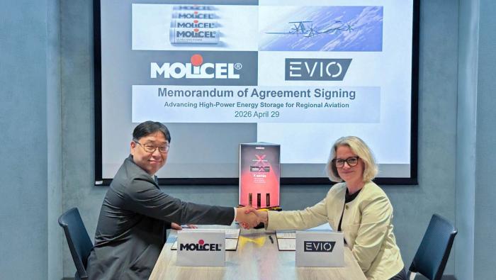Molicel president Casey Shiue, left, and Evio vice president of operations and general manager Valerie Myers shake hands following the signing of a development agreement on April 29.