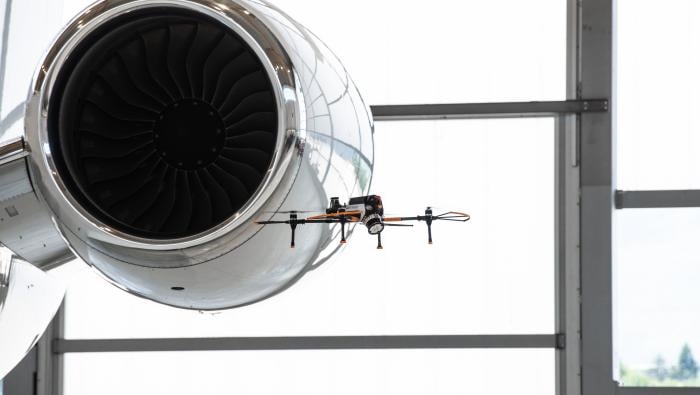 Drone conducting aircraft exterior inspection