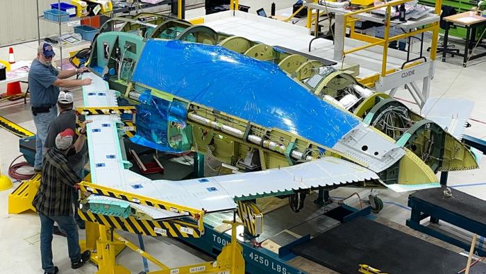 Novel triangular wing being fitted to X-65 fuselage 