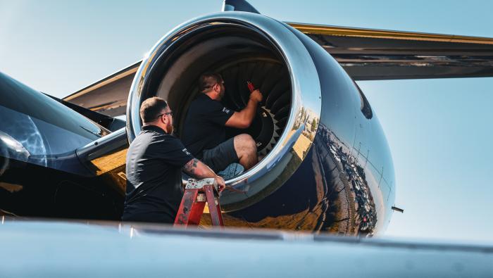 Duncan Aviation AOG technicians examining aircraft engine