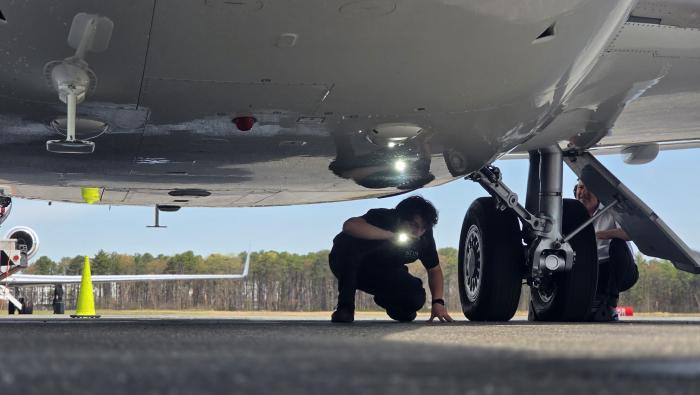 technician examining landing gear