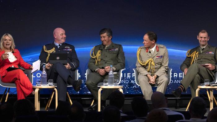 Five panel members seated