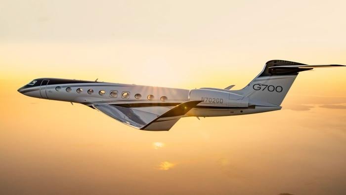 A Gulfstream G700 in flight at twilight