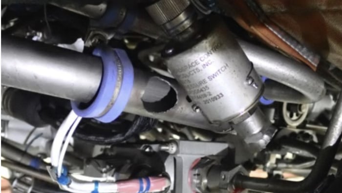 Figure 1 from the NTSB preliminary report: Right engine fuel tube assembly and fuel pressure switch, showing damage to the system