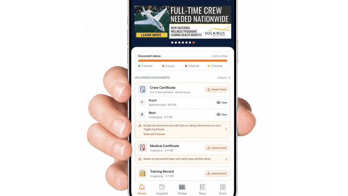 A hand holding a smartphone with CertiFly on the screen
