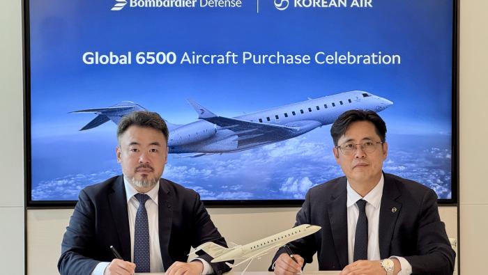  HyeonCheol Cho, v-p of defense business for Korean Air (right), with Hoon Seok Jang, sales director for Bombardier Defense