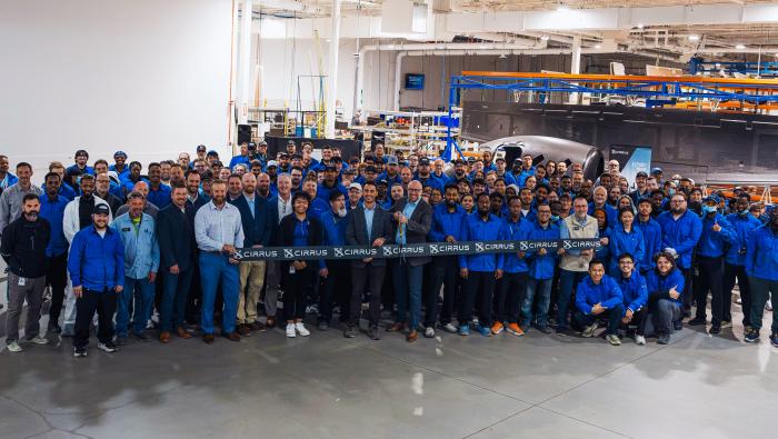 Cirrus employees celebrate the Grand Forks facility's expansion