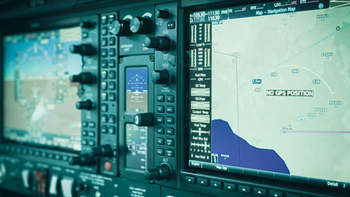 a close up view of an aircraft cockpit showing contemporary avionics