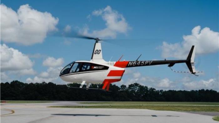 R66 hovering above ground 
