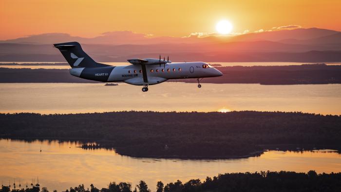 Heart X1 flying over lake at sunset 