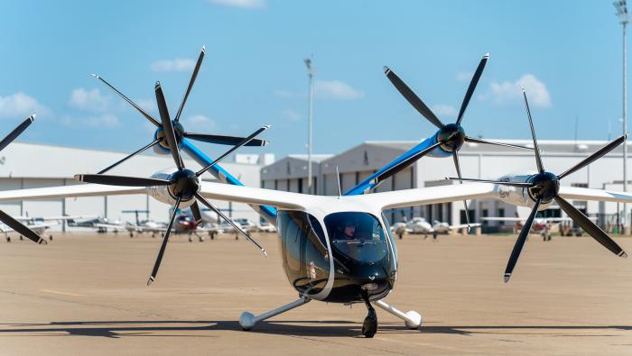 Joby’s eVTOL air taxi prototype sits on the ramp at Perot Field