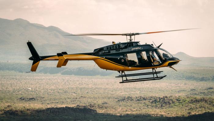 Bell helicopter flying in east Africa