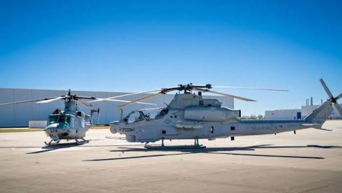 Two grey aircraft on apron 