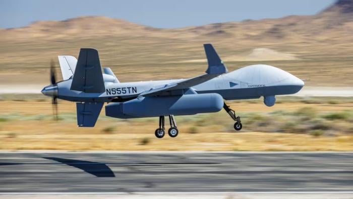 MQ-9 taking off from runway in desert 