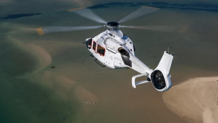 Airbus H160 in flight over sea 