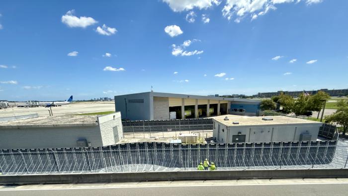 Hurricane protection fencing rises around the electrical system vaults at KTPA