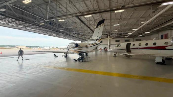 In-house maintenance and detailing crew prepare two of the aircraft for a late-night departure. 