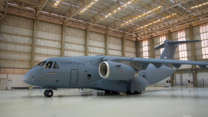 Grey C-390 in hangar 