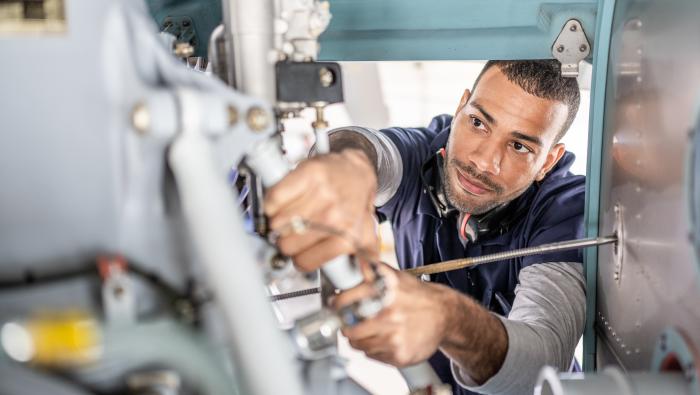technician examining airframe