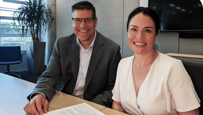 Bill Dolny and Elmarie Marais signing the agreement