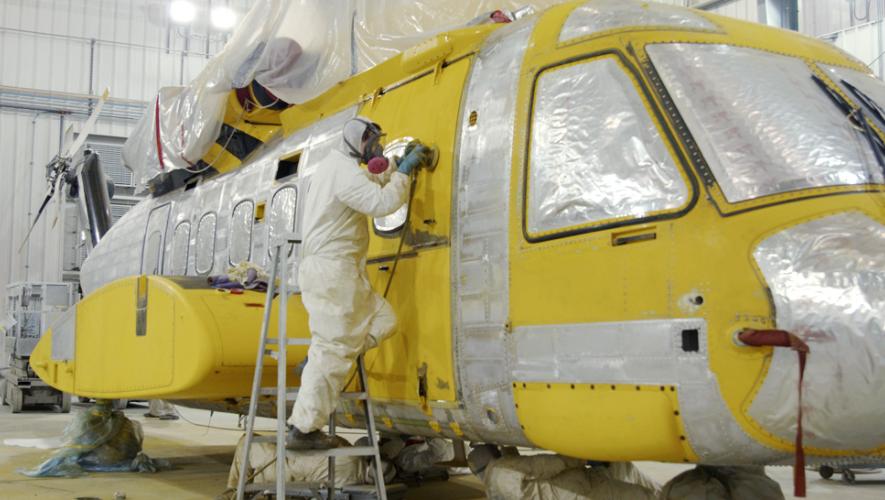 Summit Aviation technician painting aircraft