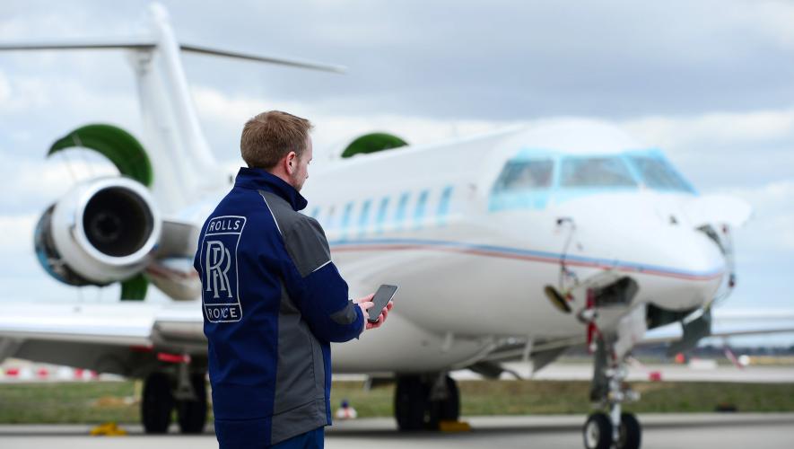 Rolls-Royce technician with iPhone