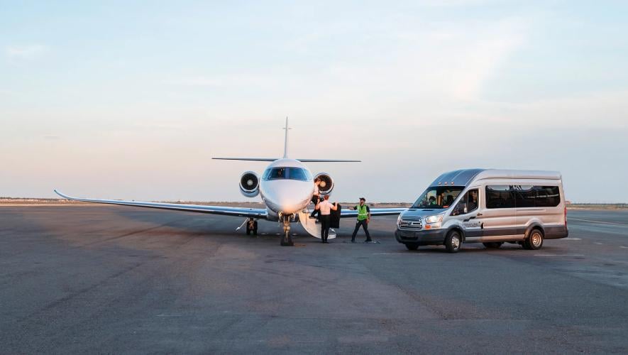 Signature Aviation van meeting business jet on ramp