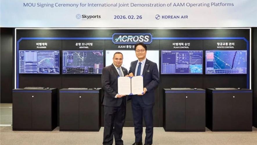 Two company representatives in front of trade stand 