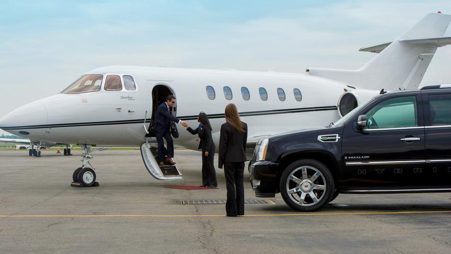 car service picking up private jet passenger on ramp