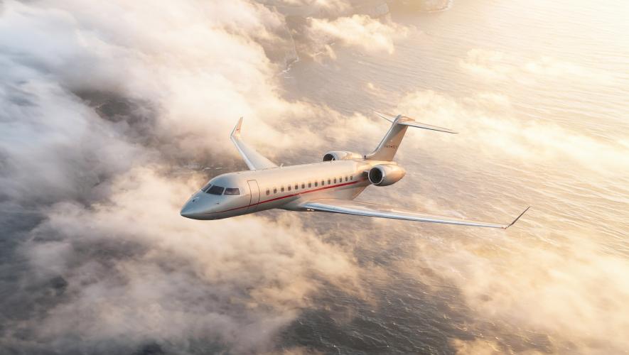 VistaJet Global 8000 in flight above clouds