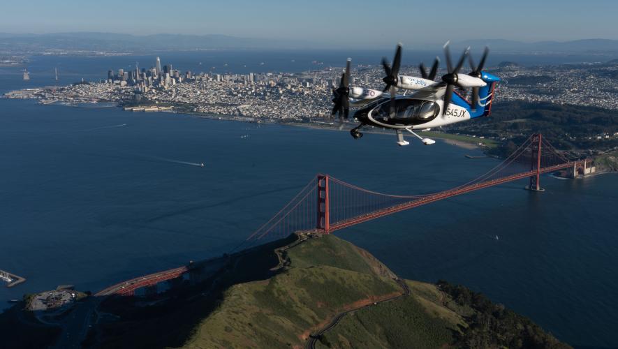 Joby's eVTOL aircraft flies over the Golden Gate Bridge