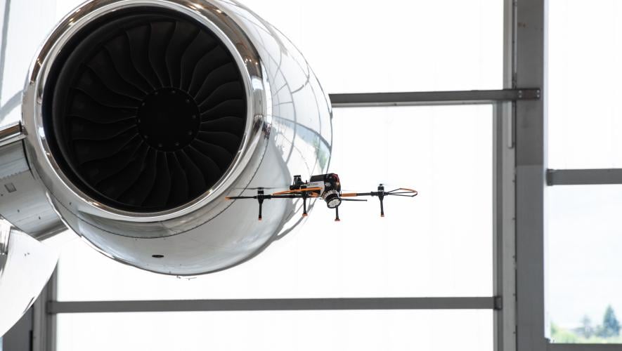 Drone conducting aircraft exterior inspection
