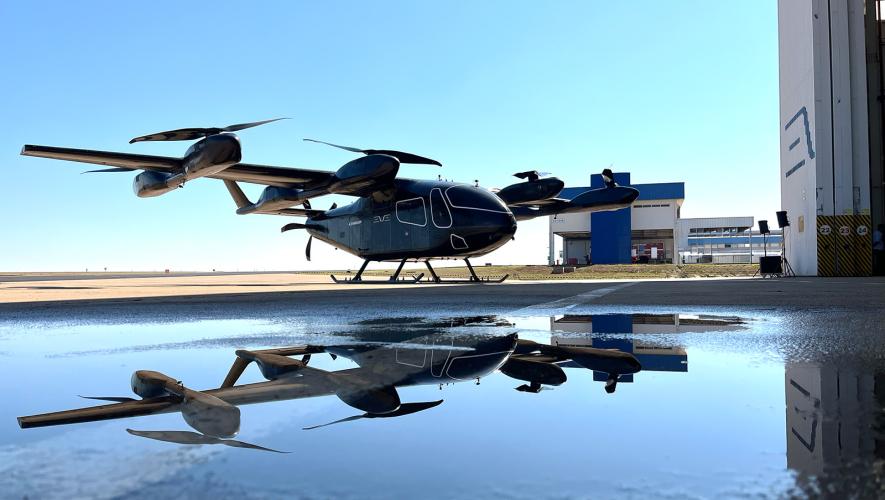 Eve eVTOL technology demonstrator in doorway of hangar 