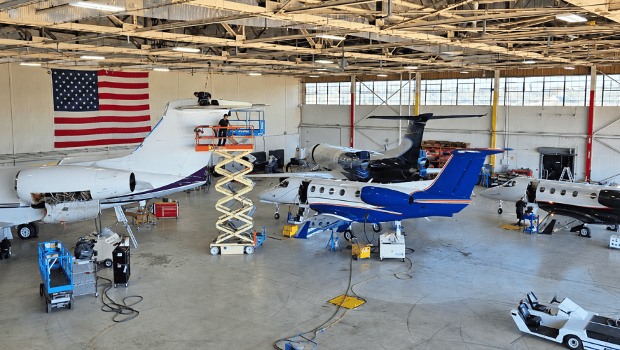 Aircraft undergoing maintenance in Altus hangar