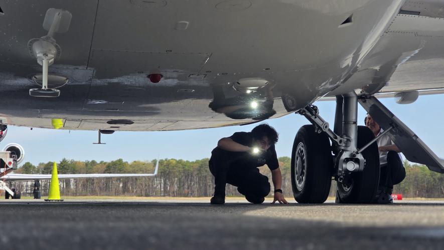 technician examining landing gear