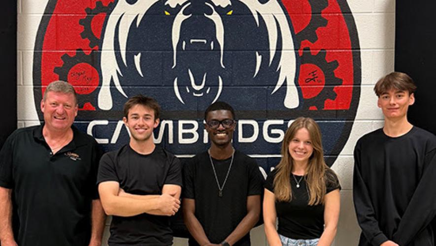 2026 GAMA Aviation Design Challenge first-place team from Cambridge High School Porter High School (from left to right: John Friske (teacher) Clark Benner, Christian Seawright, Morgan Smith and Adam Gould).