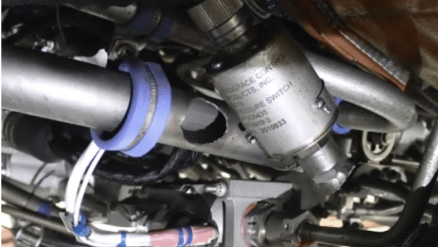 Figure 1 from the NTSB preliminary report: Right engine fuel tube assembly and fuel pressure switch, showing damage to the system