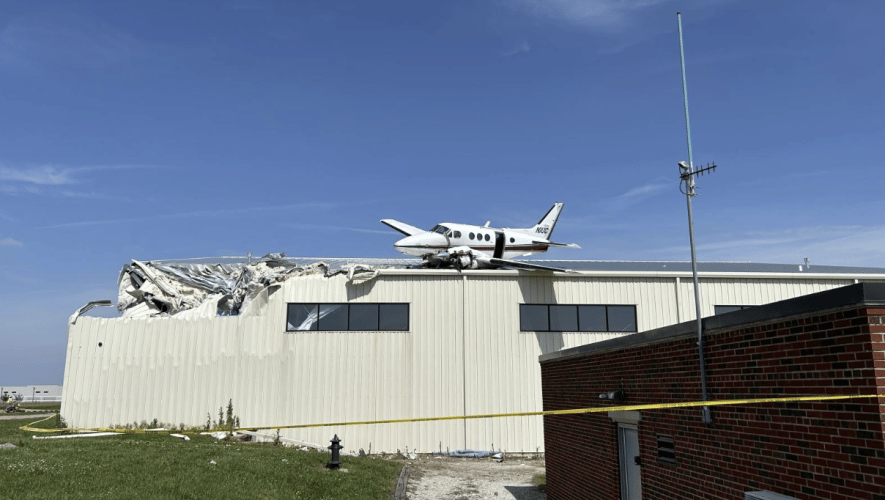 A King Air came to rest after crashing on top of a hangar at New Century airfield in Gardner Kansas