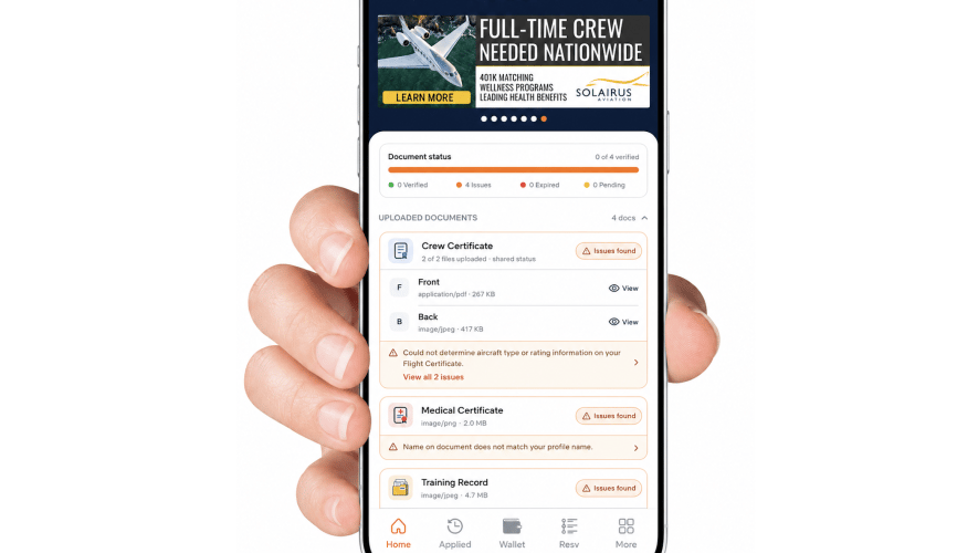A hand holding a smartphone with CertiFly on the screen