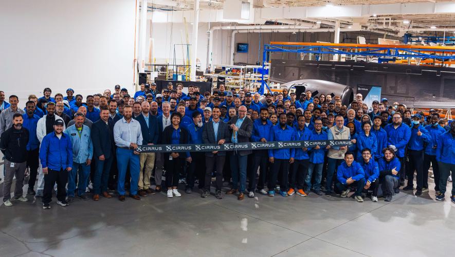 Cirrus employees celebrate the Grand Forks facility's expansion
