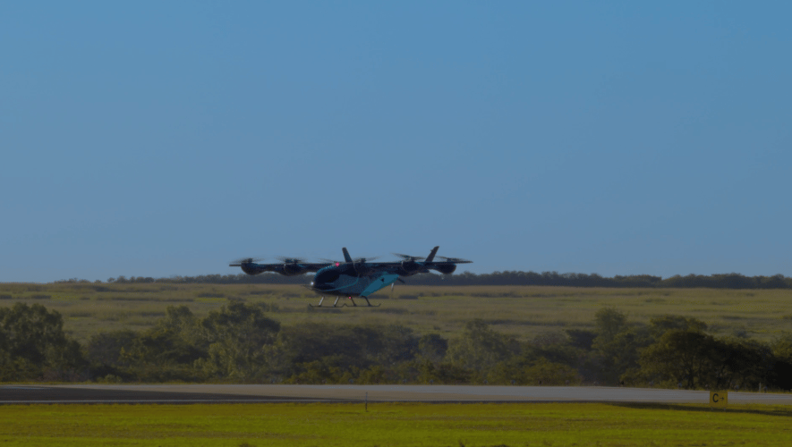 Eve prototype hovering above runway 